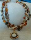 Twisted strands of multi-colored stone b